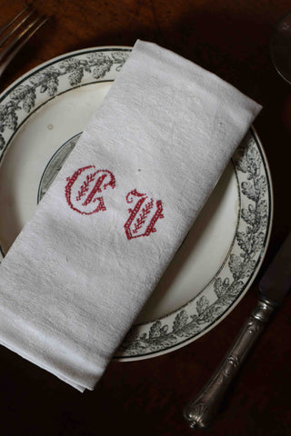 French damask napkins embroidered with GV initials in red thread