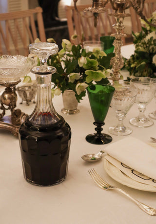 Antique glass decanter with octagonal stopper and faceted sides, 34cm tall