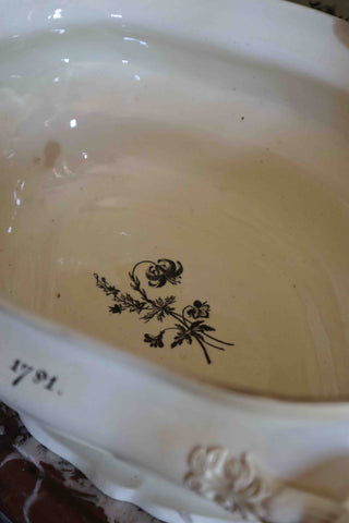 Elegant antique English tureen with sculpted handles and decorative scenes