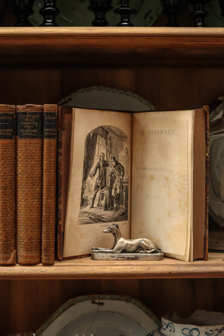 Set of 9 decorative antique books with gilt spines and marbled covers for sale