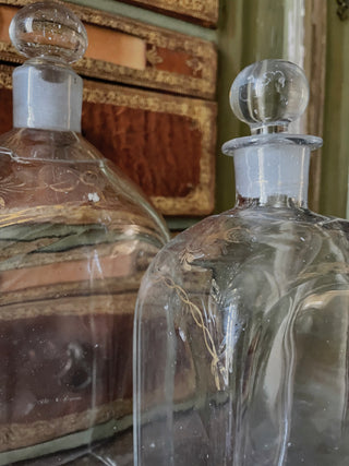French glass decanters, 18th century, with worn gilded neck decoration