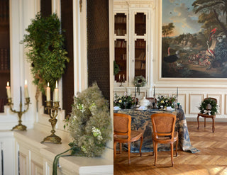 Holiday inspired tablescape with antique plates and seasonal flowers in French chateau