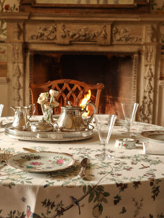 Antique European porcelain plate on a floral tablecloth