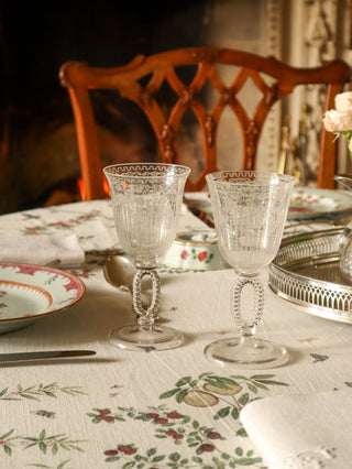 Antique hand-blown wine glasses with etched floral patterns