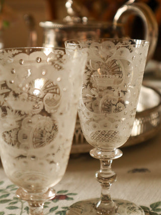 Close-up of antique etched wine glass with initials SB