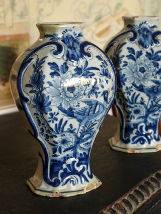 Matching Dutch Delft pottery vases hand-painted in cobalt blue