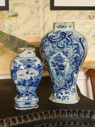 Pair of antique Delft blue and white vases with floral and landscape designs