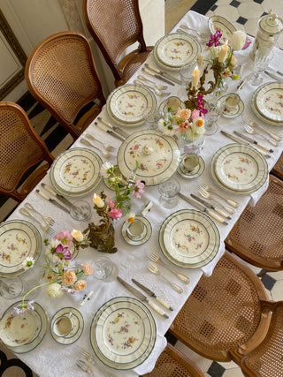 tablescape with white french linen and floral plates 