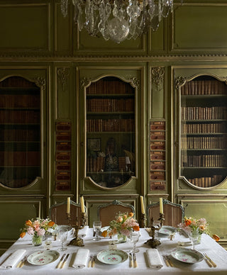 Antique style table setting in a french chateau library