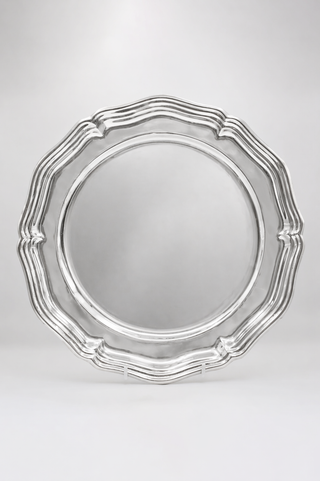 Silver scalloped charger plate for hire in London. Rent vintage tableware UK