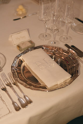 Tablescape with silver scalloped charger plate for hire, event styling london.