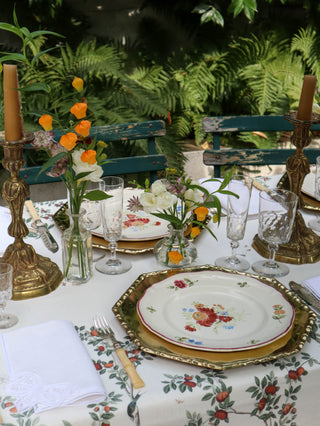 Antique French cut crystal glassware suite on styled tablescape with bamboo brass charger plates. 