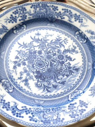 Close-up of the slightly scalloped rim on an antique blue and white transferware plate