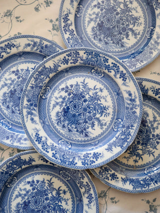 Side profile of an antique chinoiserie transferware plate showing rim shape and glaze